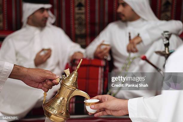 arab men on a tea session - majlis stock pictures, royalty-free photos & images