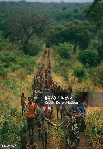 Young Christian children who fled the civil war in the Sudan arrive at an abandoned Catholic mission near Palotaka, South Sudan. Two hundred...