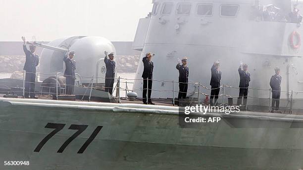 China's People's Liberation Army Navy wave after arriving at their base in Hong Kong, 25 November 2005, during the eighth annual troop rotation in...