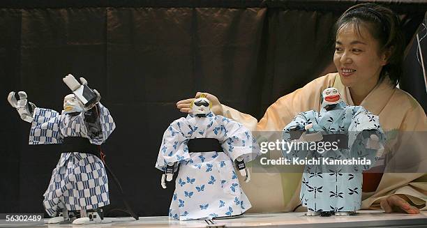 Dancing robot "Eco-robots" of iXs Research Corp perform Japanese dance during 2005 International Robot Exhibition on November 30, 2005 in Tokyo,...