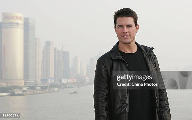 Actor Tom Cruise poses for the press at the end of a news conference promoting his new film Mission Impossible III atop Shanghai's historic Bund 18...