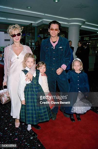 Australian singer and songwriter Michael Hutchence and British television presenter Paula Yates with two of Yates' daughters, Peaches Geldof and...