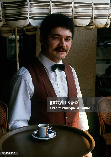 Parisian cafe server Paris, France.