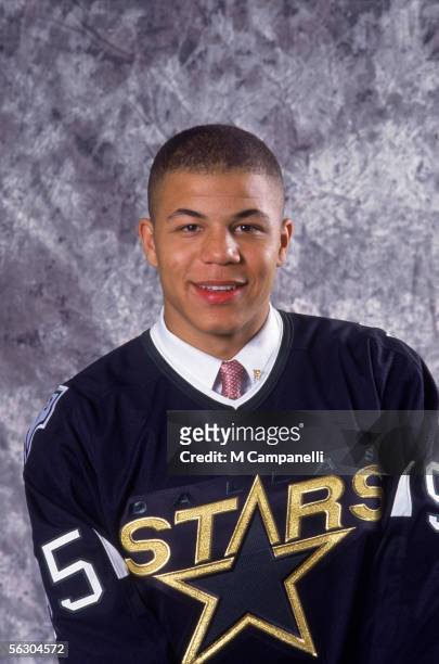 Canadian professional hockey player Jarome Iginla poses for a portrait in his new team jersey after he was drafted by the Dallas Stars at the 1995...