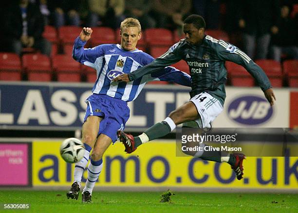 Charles N'Zogbia of Newcastle United challenges Gary Teale of Wigan Athletic during the Carling Cup, fourth round match between Wigan Athletic and...
