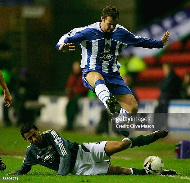 Nolberto Solano of Newcastle United challenges Steve McMillan of Wigan Athletic during the Carling Cup, fourth round match between Wigan Athletic and...