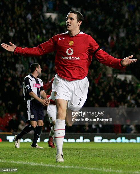 John O'Shea of Manchester United celebrates scoring his teams third goal during the Carling Cup match between Manchester United and West Bromwich...