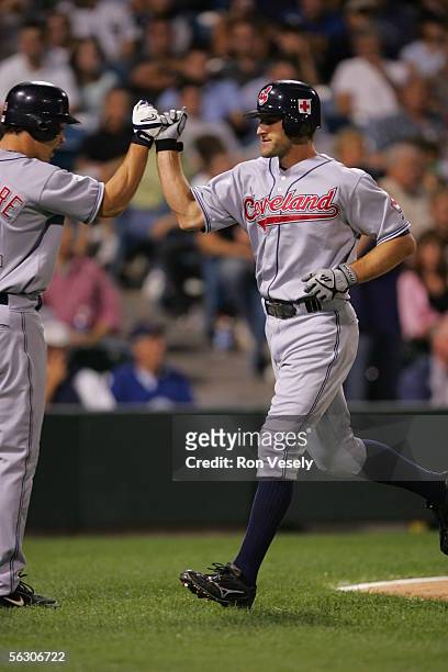 Casey Blake of the Cleveland Indians is greeted by teammate Grady Sizemore during the game against the Chicago White Sox at U.S. Cellular Field on...