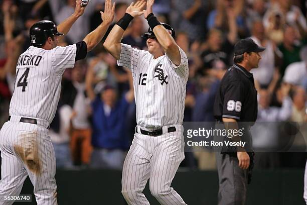 Paul Konerko and A.J. Pierzynski of the Chicago White Sox greet one another during the game against the Cleveland Indians at U.S. Cellular Field on...