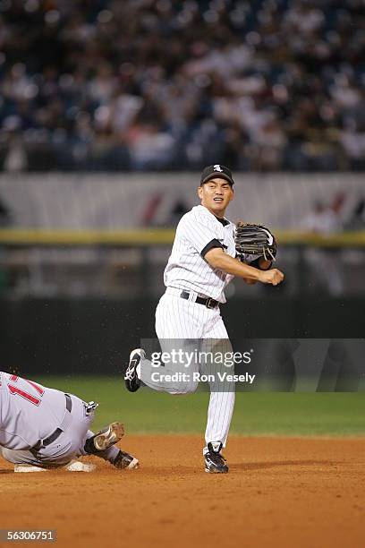 Tadahito Iguchi of the Chicago White Sox fields as Aaron Boone of the Cleveland Indians slides during the game at U.S. Cellular Field on September...