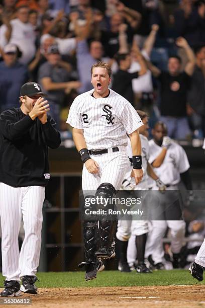 Mark Buehrle and A.J. Pierzynski of the Chicago White Sox celebrate a walk-off win against the Cleveland Indians at U.S. Cellular Field on September...