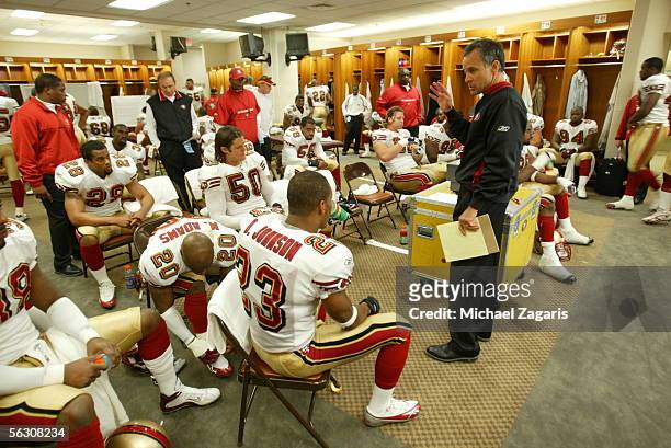 Head Coach Mike Nolan of the San Francisco 49ers addresses the team in the locker room at halftime during the game against the Tennessee Titans at...