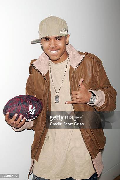 Rapper Chris Brown poses for a photo backstage during MTV's Total Request Live at the MTV Times Square Studios on November 30, 2005 in New York City.