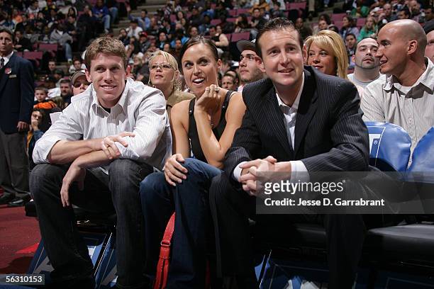 Nascar drivers Carl Edwards, Kurt Busch and swimmer Amanda Beard watch the game between the New Jersey Nets and the Detroit Pistons on November 30,...