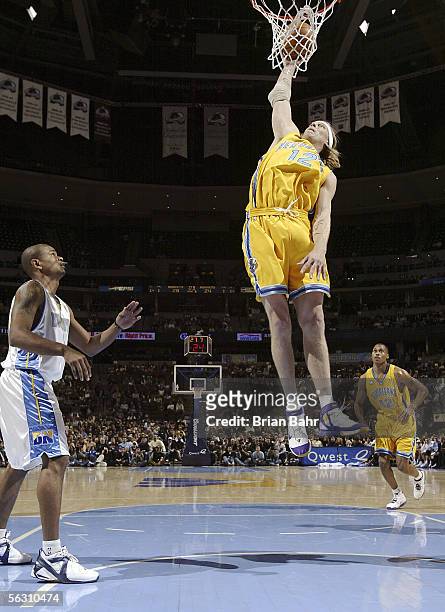 Chris Andersen of the New Orleans/Oklahoma City Hornets works to put the ball in the basket against the Denver Nuggets in the first half on November...