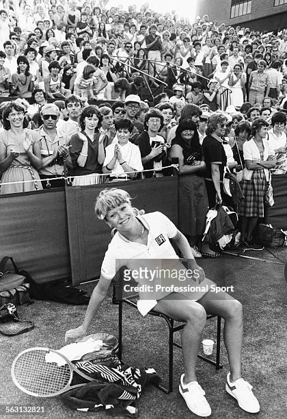 British tennis player Sue Barker smiles as spectators applaud behind her, following her victory over Rene Mentz of South Africa in the first round at...