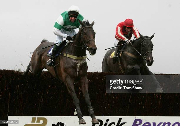 Taskina ridden by P Davy and Eggmount ridden by W McCarthy jump the final fence during the Andrew Hopkins Concrete Conditional Jockeys Handicap...