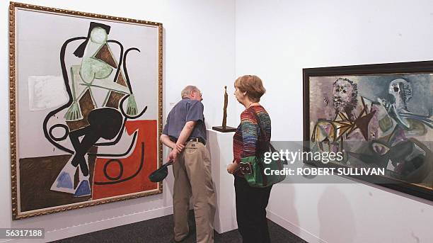 Art patrons view three works by Pablo Picasso "Femme dans un Rocking-chair", "Femme debout" and "Homme assis et centaure" 01 December 2005, at Art...