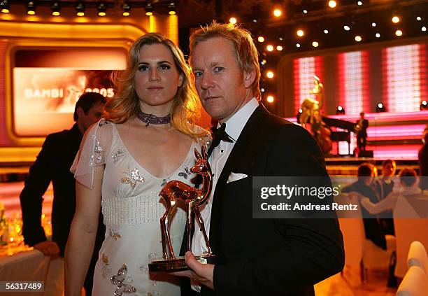 Host Johannes B. Kerner poses with his wife Britta Becker-Kerner and his trophy on their way to the after show party of the 57th annual Bambi Awards...