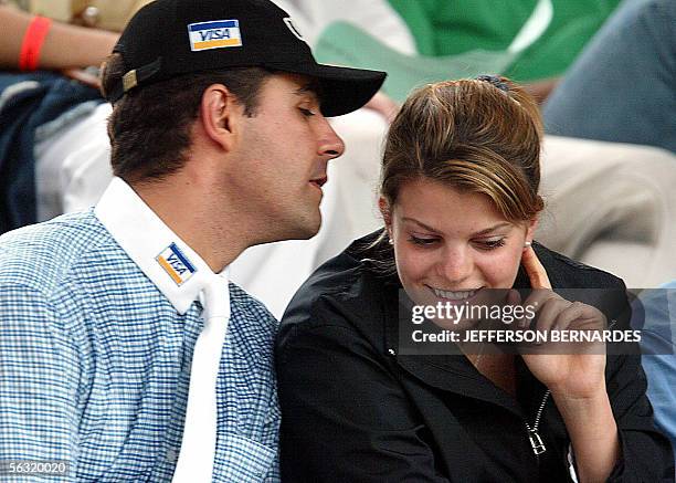 Greek millionaire Athina Onassis Roussel talks with her Brazilian fiance and rider Alvaro Affonso de Net Miranda during an international equestrian...