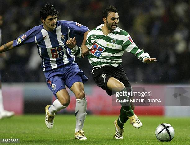 Porto's Argentinian Lucho Gonzalez vies with Sporting CP's Carlos Martins during their Portuguese Super League football match at Dragao Stadium in...