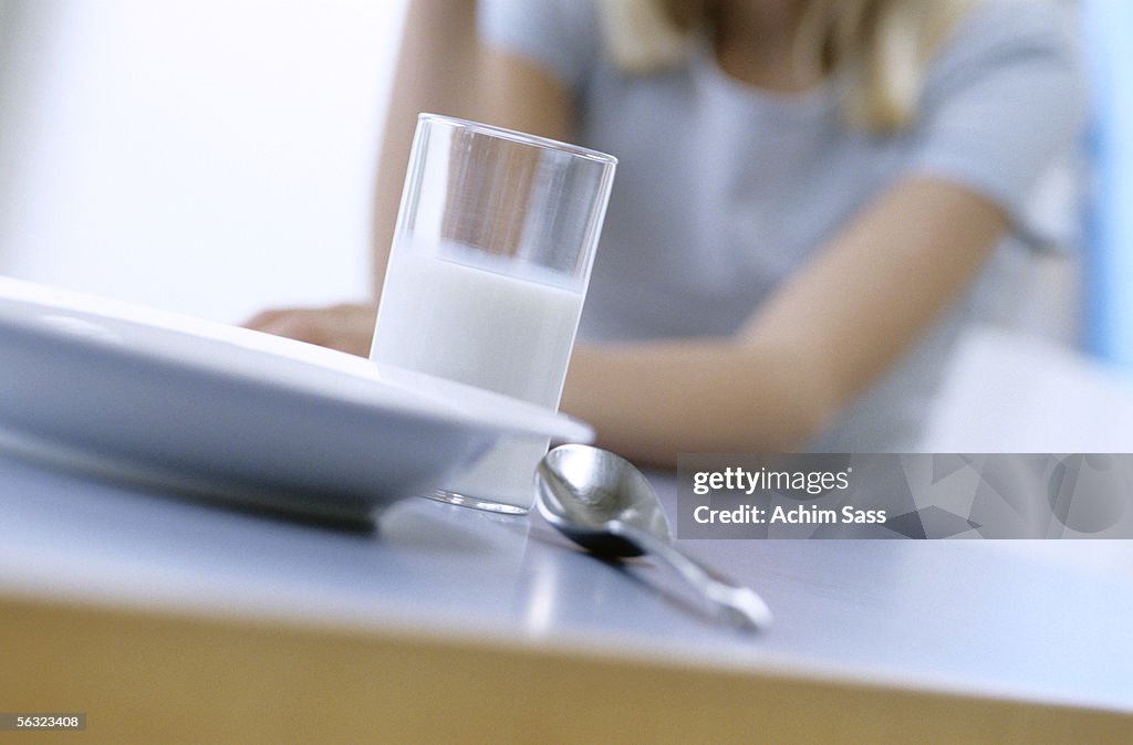 Girl in front of breakfast table