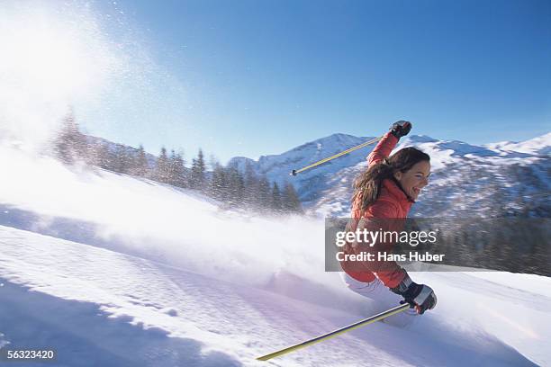 young woman skiing - vacanza sulla neve foto e immagini stock