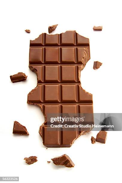 chocolate slab - biting stock pictures, royalty-free photos & images