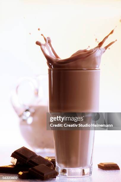 hot chocolate and pieces of chocolate, close-up - chocolate milkshake stock pictures, royalty-free photos & images