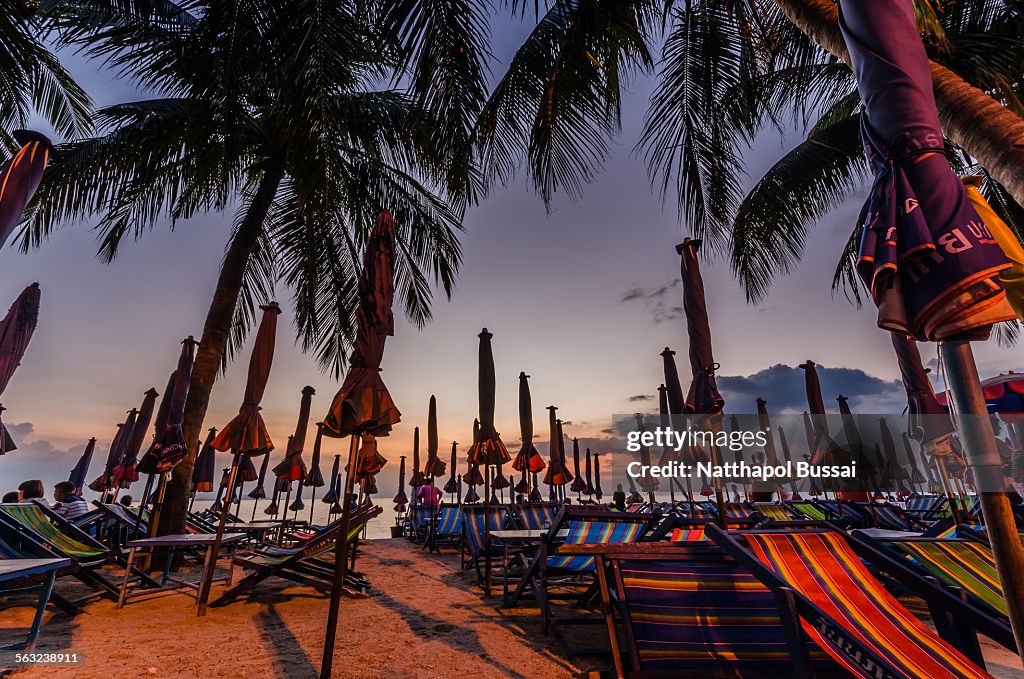 Closing Umbrella at Chonburi beach , Thailand