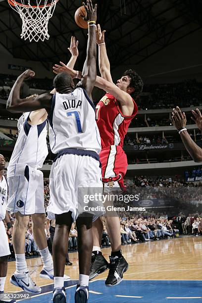 Zaza Pachulia of the Atlanta Hawks shoots against the Dallas Mavericks during the game at American Airlines Arena on November 17, 2005 in Dallas,...