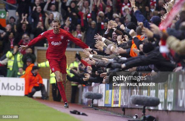 Liverpool, United Kingdom: Liverpool's Peter Crouch celebrates after soring his first goal against Wigan during their Premiership match at Anfield,...