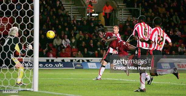 Ade Akinbiyi of Burnley equalises with a diving header past Antti Niemi of Southampton during the Coca-Cola Championship match between Southampton...
