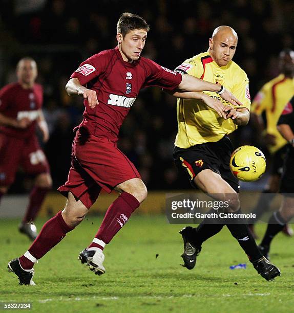 Gavin Mahon of Watford fights for the ball with Chris McPhee of Brighton & Hove Albion during the Coca-Cola Championship match between Watford and...