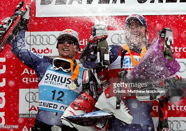 Daron Rahlves and Bode Miller celebrate on the winner's podium during FIS Alpine Skiing World Cup giant slalom race on December 3, 2005 on Birds of...