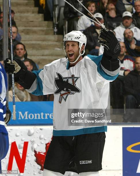 Joe Thornton of the San Jose Sharks celebrates his teammate's winning goal, which he assisted, against the Toronto Maple Leafs on December 3, 2005 at...