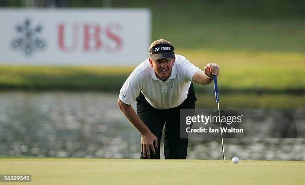 Colin Montgomerie of Scotland lines up a putt during Day Four of the UBS Hong Kong Open at the Hong Kong Golf Club on December 4, 2005 in Fanling,...