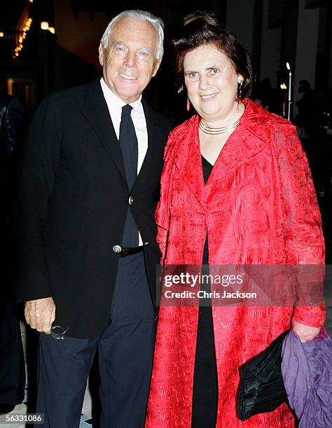 Designer and businessman Giorgio Armani poses with Suzy Menkes, Fashion editor of the International Herald Tribune as they attend a drinks reception...