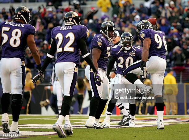 Adalius Thomas of the Baltimore Ravens is congratulated after returning an interception for a touchdown during the second half of the game against...
