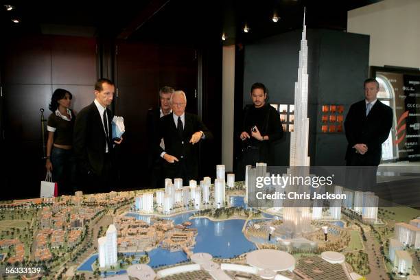 Designer and businessman Giorgio Armani examines a model of the Burj Dubai at Modern Luxury at the Park Hyatt Hotel on December 5th 2005 in Dubai,...