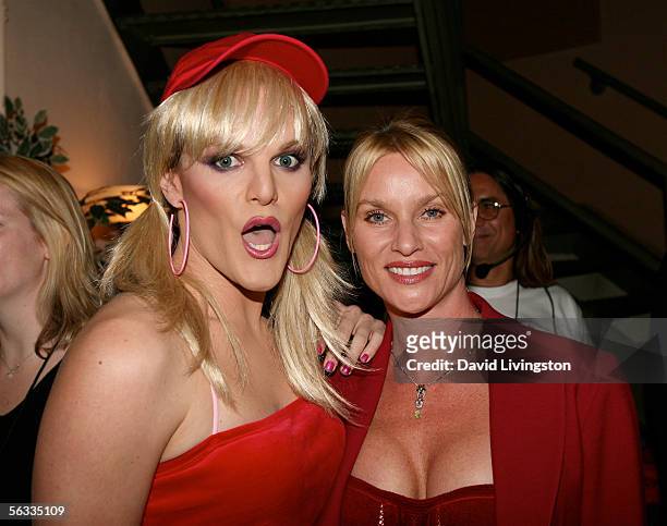 Actress Nicollette Sheridan poses with her "look-alike" at "Cracked Xmas 8", the annual charity gala to benefit The Trevor Project, at the Wiltern LG...