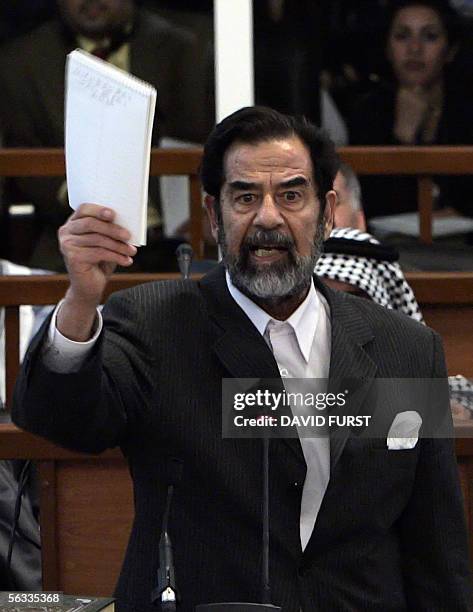 Former Iraqi President Saddam Hussein addresses the court as Awad Hamed al-Bander , Taha Yassin Ramadan , Abdullah Kadhem Ruaid , Mizher Abdullah...