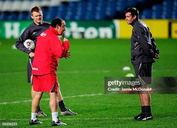 Manager Rafael Benitez speaks to John Arne Riise and Jamie Carragher during the Liverpool Football Club press conference and training session ahead...