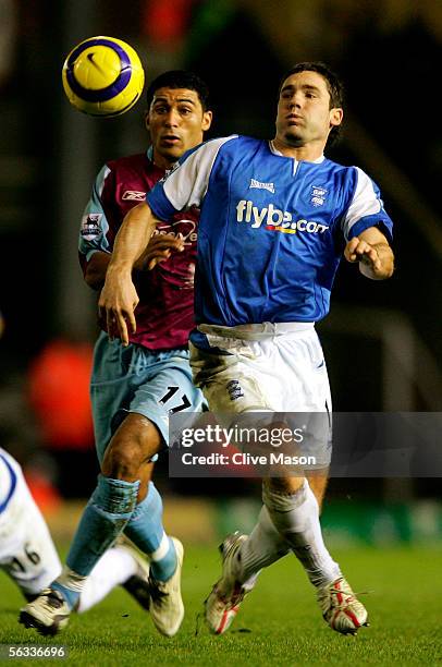 Hayden Mullins of West Ham is challenged by David Dunn of Birmingham City during the Barclays Premiership match between Birmingham City and West Ham...