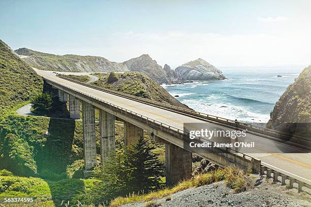 empty bridge overlooking the sea - two lane highway fotografías e imágenes de stock