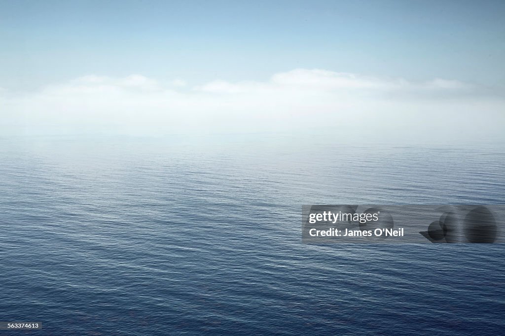 A calm sea fading into the sky