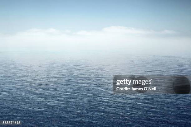 a calm sea fading into the sky - seascape stock pictures, royalty-free photos & images