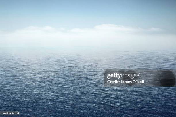 a calm sea fading into the sky - water horizon stock pictures, royalty-free photos & images