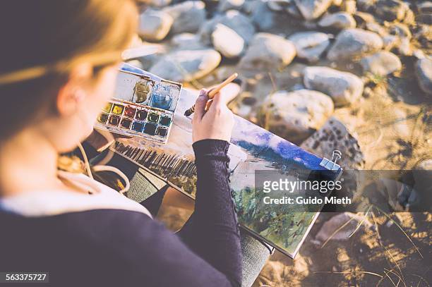 woman painting watercolour outdoor - longeville sur mer stock pictures, royalty-free photos & images