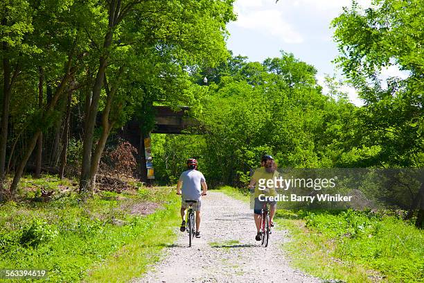 man and woman bicycling on atlanta beltline - the beltline atlanta georgia stock pictures, royalty-free photos & images
